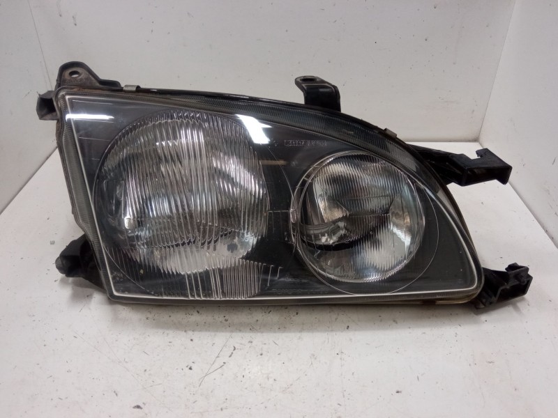 Recambio de faro derecho para toyota avensis liftback (_t22_) 1.6 (at220_) referencia OEM IAM   